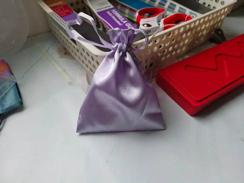 Velvet Drawstring Pouch for Jewelry Packaging velvet jewelry pouch holding rings and bracelet on display tray